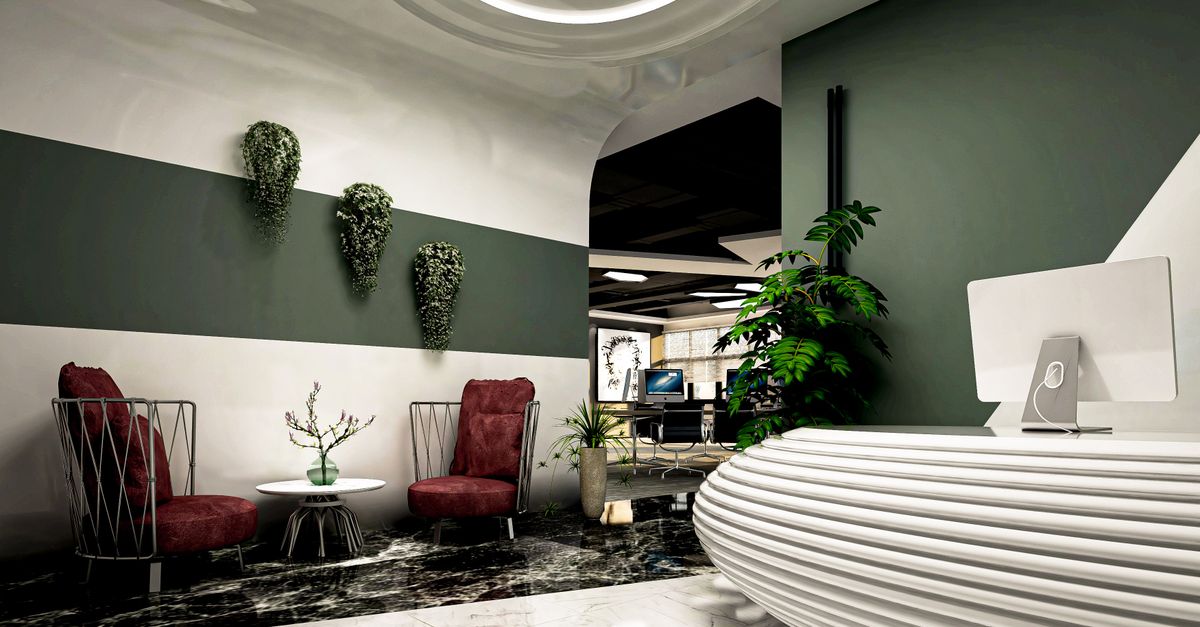 Elegant reception area featuring modern decor with burgundy chairs and greenery in Casablanca, Morocco.